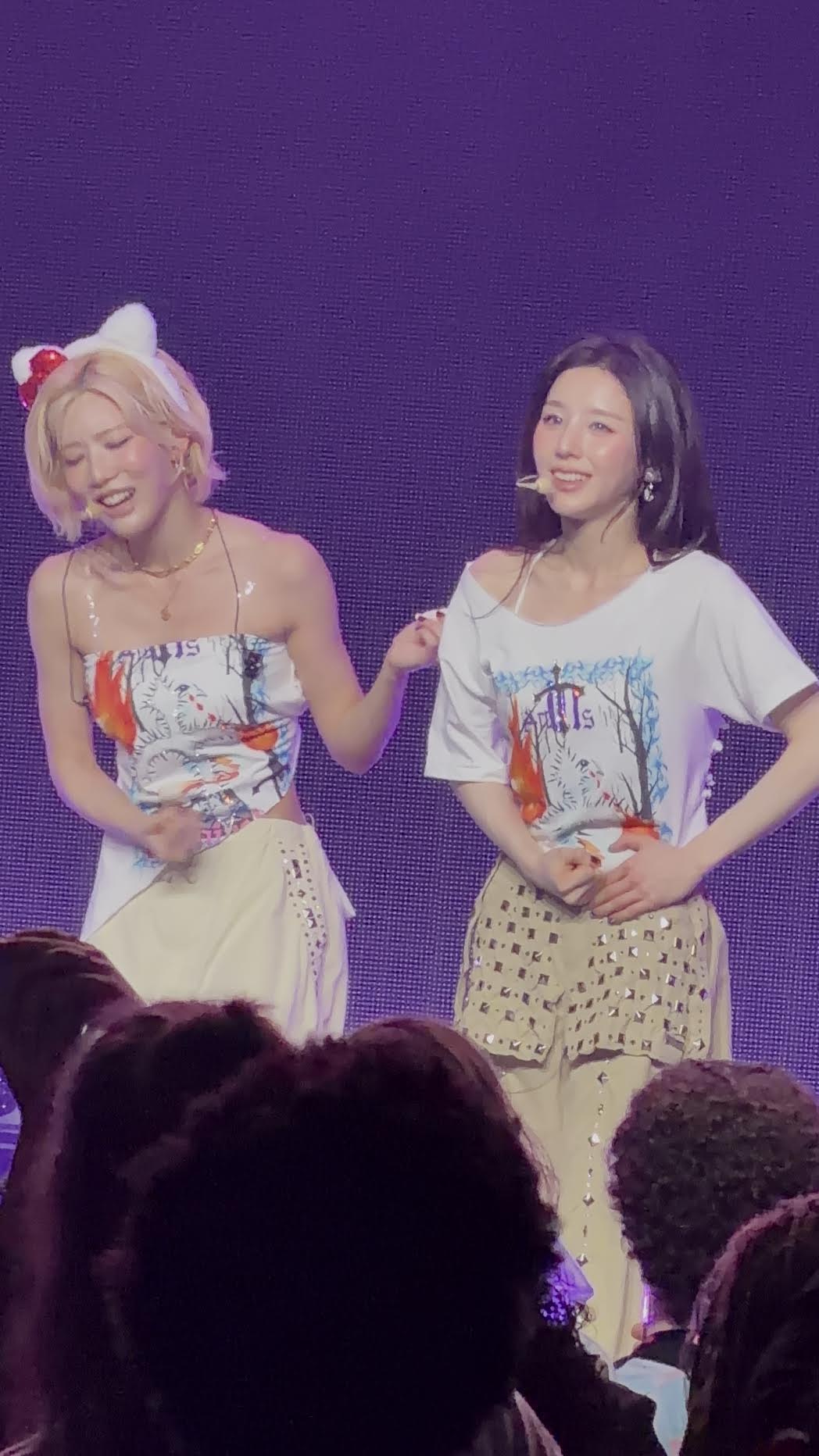 Two ARTMS members smiling onstage at The Plaza Live